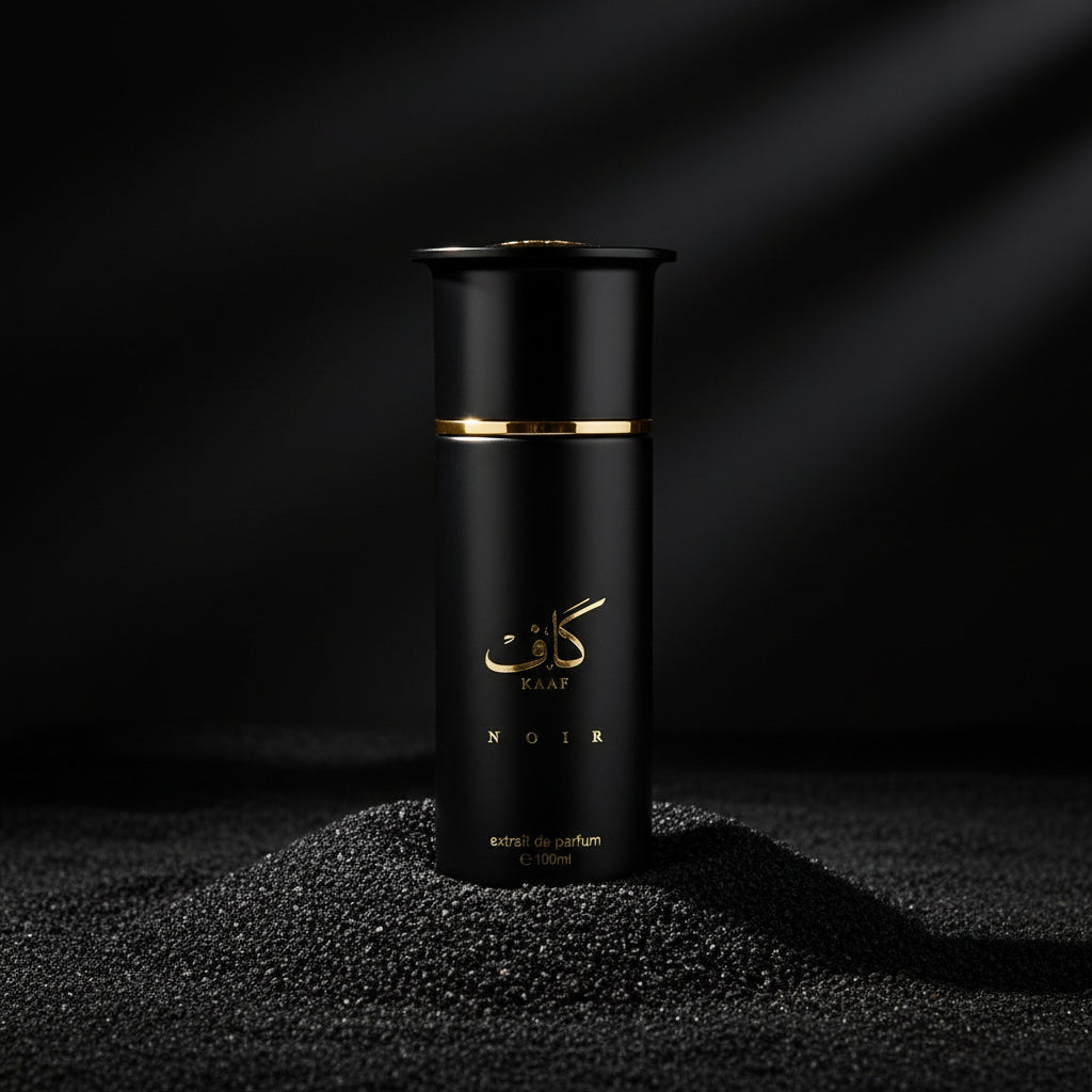 Black perfume bottle with gold accents on a white background